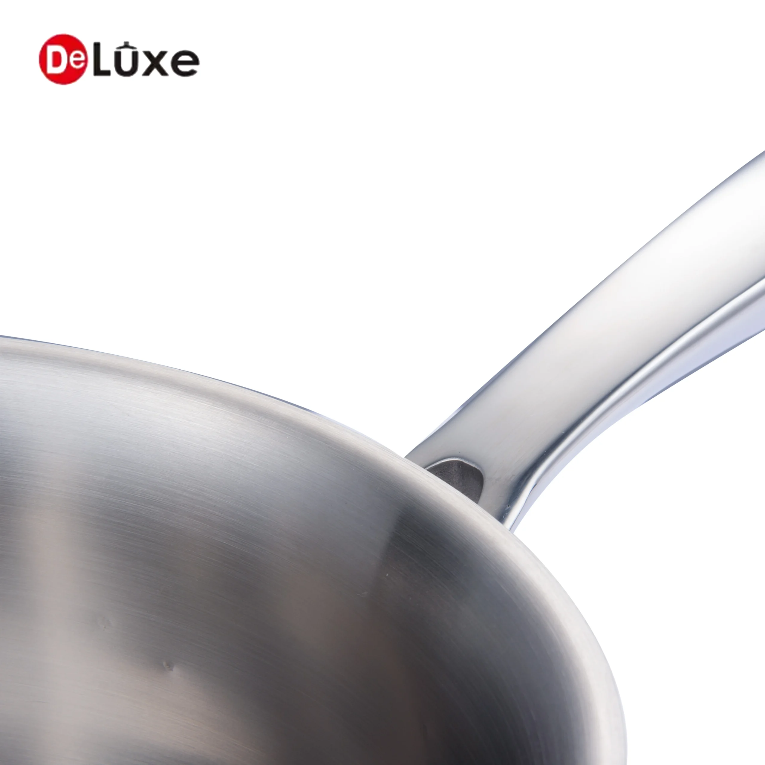 Detail shot of solid silver cast steel single handle and smooth interior of belly shape saucepan