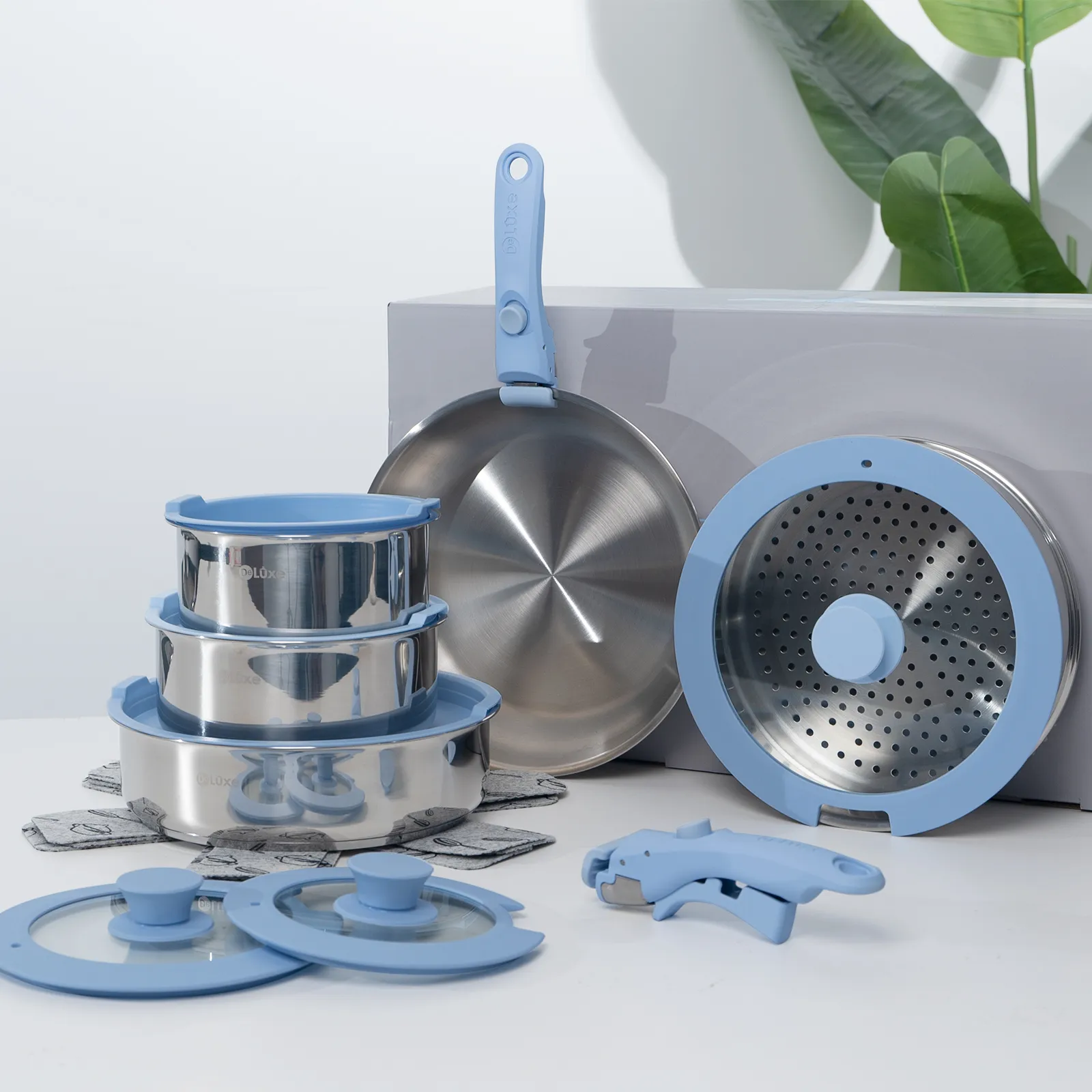 DeLuxe blue removable handle stainless steel cookware set still life detailed display photo