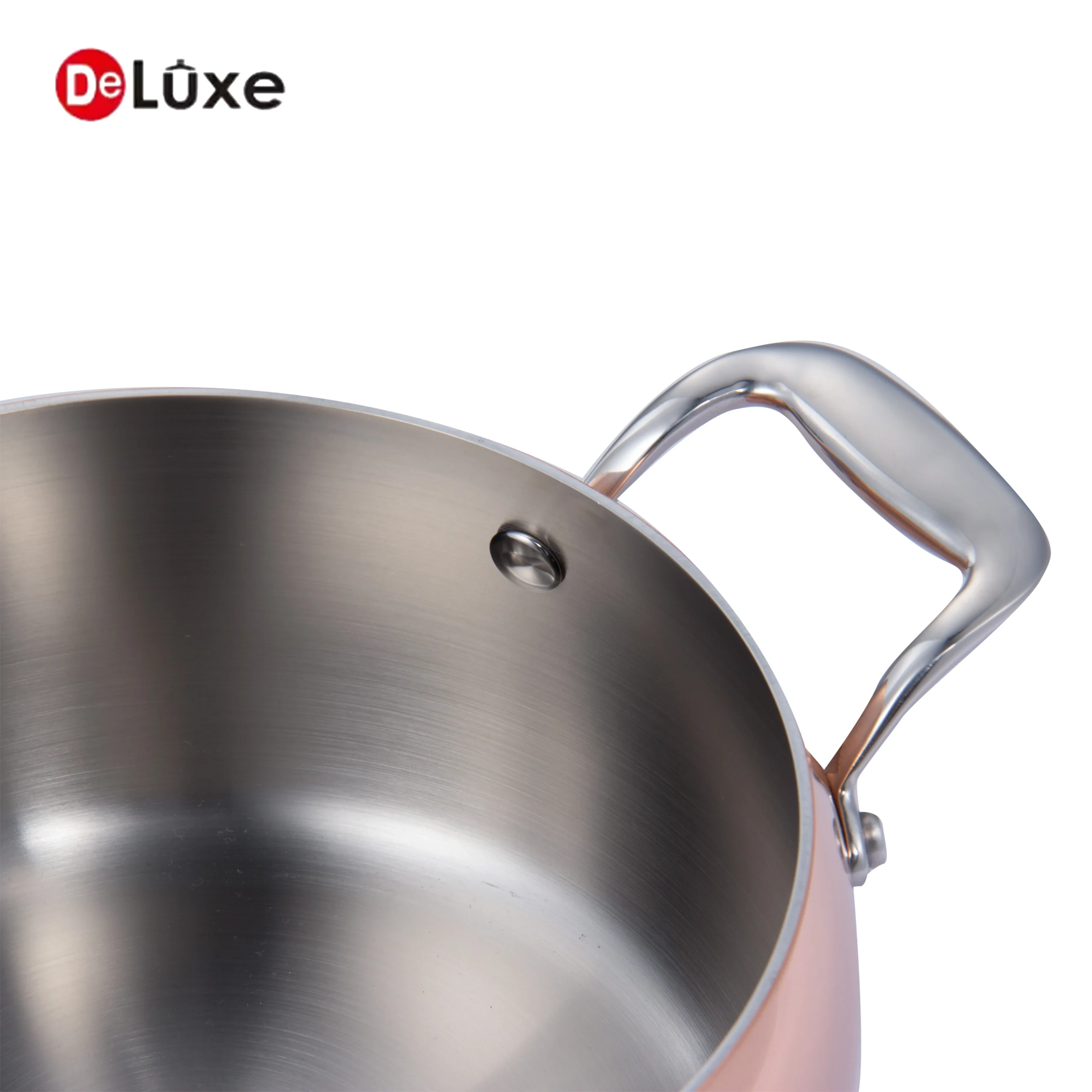 Detail shot of double cast steel handles and smooth interior on composite copper stock pot