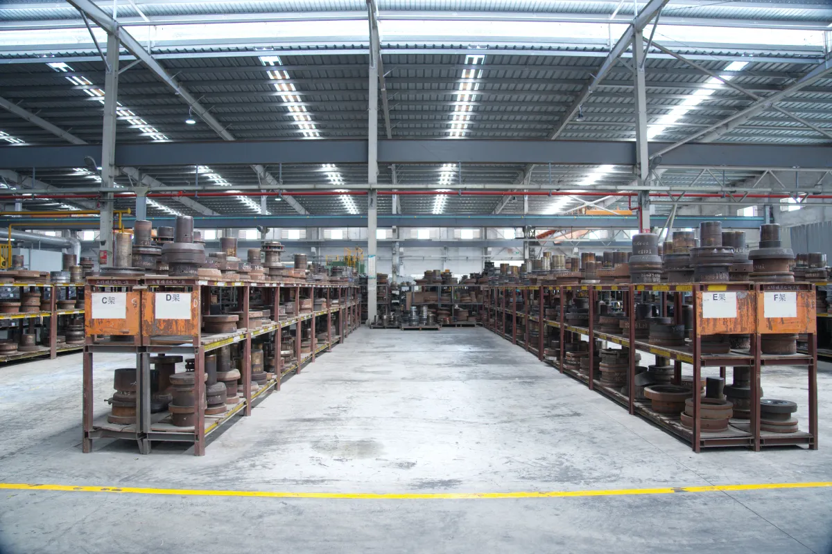 Racks of stainless steel cookware moulds and press dies in our tooling room