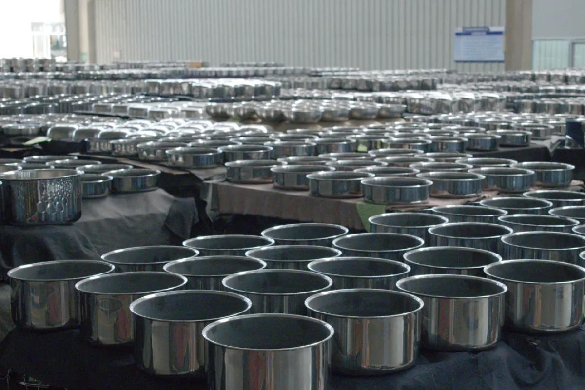 Mass finished stainless steel stock pots waiting for quality inspection in our cookware factory workshop, large-scale production capacity for global OEM and wholesale orders.